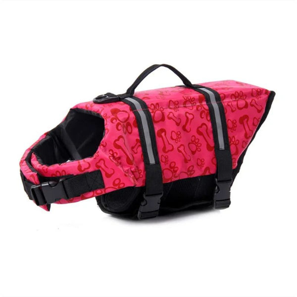 Gilet de sauvetage pour chien rose vif avec motifs os et pattes.