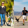 Homme et femme utilisant une laisse mains libres pour chien en promenade et en course