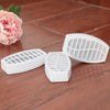 Filtres de remplacement au charbon actif pour fontaine à eau pour chat, posés sur un parquet - Toutou Love